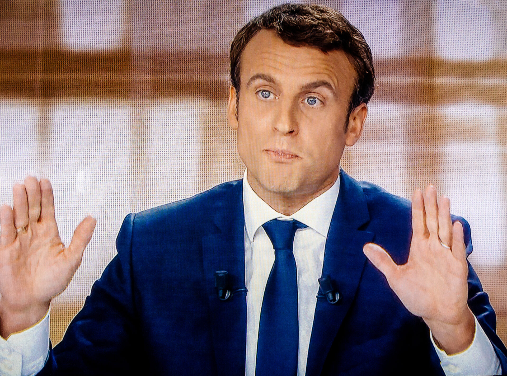 Macron’s Handshake Sparks Outrage, Raises Security Concerns